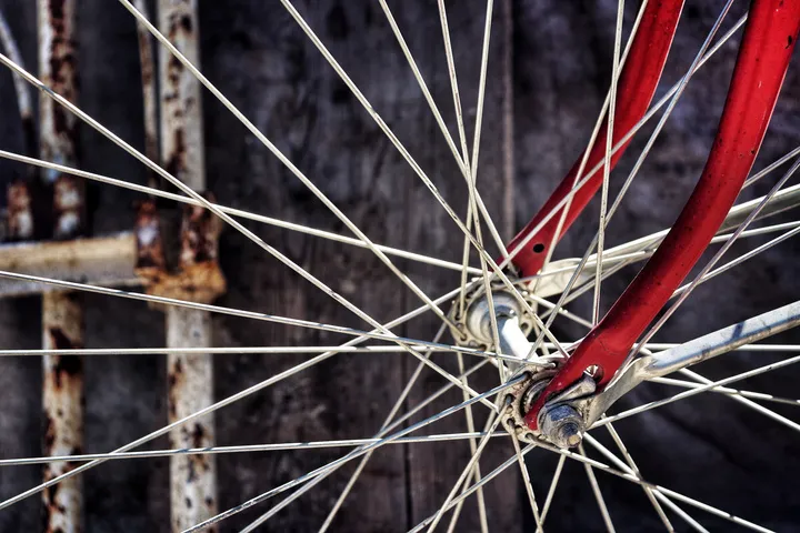 Red bicycle wheel spokes